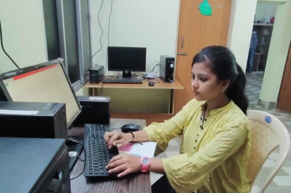 Sangeeta using a computer.