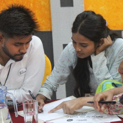 Youth hackathon participants collaborating in a group mapping exercise